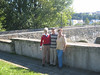 The Elster Bridge (Die Elsterbruecke), Plauen, Germany‏ : Thomas (Tom) Stafford,
L Company, 347th Inf. Regt., 
87th ID- WWII

The Elster Bridge (Die Elsterbruecke), Plauen, Germany

During the 347th Infantry Regiment's attack on Plauen, Germany (April 16, 1945), Company L reached a point approximately one kilometer from the Elster River, 
which divided the city. At the same time Capt. Kidd, Commander of Company L, received a message that one of our spotter aircraft had observed a German platoon-sized force which appeared to be setting demolition charges in preparation of destroying the sole remaining bridge across the river, apparently hoping to delay the regiment's advance. Capt. Kidd radioed Tom Stafford, Acting Platoon Leader of the 2nd Rifle Platoon, saying he wanted the 2nd to move through Lew Goad's 1st Rifle Platoon (which had been leading the move into Plauen) and prevent the Germans from destroying the bridge. The upper structure (e.g., side walls) of the bridge had been badly damaged but the bridge was still usuable by vehicles, tanks, etc.

To provide the 2nd Platoon with additional firepower, Capt. Kidd gave Tom a section of tanks from the tank platoon which had been attached to Company L for the assault on Plauen. Moving through Lew Goad's platoon, and with the tanks following through the rubble-clogged streets, the 2nd Platoon advanced toward the bridge as quickly as possible. Arriving at the bridge, Tom observed a number of German troops at the far end. They appeared to be still in the process of setting up demolition charges under the bridge. Placing one of the tanks on each side of our end of the bridge, Tom directed them to fire a couple of cannon rounds over the heads of the Germans and then open fire with their machine guns along each side of the bridge, while Tom and his men and raced across the bridge hoping to cut the ignition wires, or otherwise neutralize the demolition charges before the bridge was blown. Suffice it to say, aided by the supporting fire laid down by the tanks, Tom succeeded in neutralizing the demolitions while his men, after capturing a number of German defenders, drove off the remaining German soldiers, without suffering any casualties. 
Having secured the bridge, Tom moved the 2nd platoon to higher ground on the far side of the river in order to ward off any counterattack which might be attempted by the Germans.

In 1990, while the Communists were still in control of East Germany, Tom and his wife, Gayla, visited the Elster Bridge (known locally as The Elsterbruecke). 
They learned that the people of Plauen apparently had persuaded the authorities to declare the bridge a "National Treasurer".
The area at both ends of the bridge, which as of 1990 had been restricted to foot traffic, had been turned into lovely little parks.

They also learned that the bridge is believed to have been constructed prior to 1244 -- nearly 250 years before Columbus discovered the Americas! 
The Elster Bridge also is believed to be the oldest "arched" stone bridge still in existence north of Italy.

 I have been informed that a number of German reenactors, playing the part of fully equipped 
American soldiers as well as German Wehrmacht soldiers, are planning to stage next April the "liberation" 
of Plauen by the 347th Inf. Reg.-- and also are endeavoring to have a plaque placed at the Elster Bridge 
crediting the 347th Inf. Reg. for saving the "Old Stone Bridge" from destruction.


(you may read more about the final months of the war in Europe at the following website)
http://www.87thinfantrydivision.com/History/347th/Personal/000019/000019.html

=========
Tom, Gayla, her sister Petra and their Aunt Christel visted the Elster Bridge in Sept., 2005.

Thanks to Mr. James Hennessey for passing this article and photos on from Mr. Stafford, 
and for Mr. Stafford giving permission to place on this gallery.

That is what this gallery is all about....Sharing your memories and photos from your time/place in the War for all to have...
which also might encourage other Veterans to open up and pass theirs on too.
  
 To see all photos submitted from many about the 87th Infantry Division, 
or to submit yours, go to:
http://history06.smugmug.com

and 

For info on 87th Infantry Division Association:
http://www.87thinfantrydivision.com