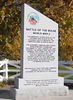history06 > This is 2 of 2 pics - Rochester, New York.
VBOB monument dedicated by the Genesee Valley Chapter 
(Rochester, NY) Veterans of the Battle of The Bulge. 
October 15, 2005. 

In attendance were:
John Foy A-347, Mitch Kaidy D-345, 
Bill Statt E-347, Frank Colgan, 
Jim Comstock HQ346, Fred Kitson D-347, 
Bob Liming Hq 2 346. 
==================
The following article by Mitch Kaidy appeared in our newsletter.

                 BULGE ECHO
GENESEE VALLEY CHAPTER  V.B.0.B.  
DECEMBER 2005                                  
HUGE, MAGNIFICENT MONUMENT                     
DEDICATED TO BATTLE OF THE BULGE 
WITH SPEECHES  AND REVERIES 
                  
By Mitchell Kaidy, Editor  

On a sunny, autumnal day in November, a great unveiling took place at Ontario Beach Park facing Lake Avenue—the dedication of a ten-feet tall white granite monument that will live in the memories and history of the Rochester-Monroe County community.

Members of the Genesee Valley Chapter, Veterans of the Battle of the Bulge, had covered the polished stone marker with an authentic World War 11 parachute owned by John Cipolla of Greece, who served with the 101st Airborne Division. Cipolla and others dramatically dropped the parachute revealing the granite monolith topped in a colorful offset of the circular symbol of the national Veterans of the Battle of the Bulge.

It was fitting that the largest battle in American history—which claimed 81,000 killed, wounded and captured 61 years ago—had erected such an imposing remembrance, drawing a gathering of over 300 from Rochester and the area, including relatives of some soldiers killed in action. 

Speakers included State Sen. Joe Robach, who played a prominent role in state financing, Monroe County Executive Maggie Brooks, Rochester Mayor Bill Johnson, Stan Wojtusik of the national Veterans of the Battle of the Bulge, Founding President Dick Brookins, and Chapter Secretary John Foy.

President Tom Hope acknowledged the visionary role of Joe Tedesco, whose suggestion of a modest monument ballooned up to the nine-foot tall  marker engraved with words contributed by the executive committee of the Genesee Valley Chapter, Veterans of the Battle of the Bulge.

Sen. Robach conceded that “It has been a long work in progress,” but paid tribute to those who persisted to make the monument a success. “If it were not for these World War 11 veterans,” he declared “we would not be here. This memorial will recognize their sacrifice and help the community show its eternal appreciation…”

Founding President Dick Brookins of the 28th Infantry Division observed that the “real heroes were those who never came home. We owe our lives to them and we will never forget them.” He introduced Gary Beikirch of Rochester, who won the Medal of Honor as a medic in Vietnam.

In a moving retrospective, Chapter Secretary John Foy, a machinegunner in the 87th (Golden Acorn) Infantry Division, declared that those who fought were “from the farms and factories, offices and schools, the sidewalks of New York to the shores of San Francisco.   For a brief moment in history, these men held our nation’s destiny in their hands,” he said, adding dramatically, “They did not fail.”
 Foy,  who  received the Bronze Star, the Combat Infantryman’s Badge, and three battle stars, recounted his still-powerful vision of his assistant gunner feeding bullets into Foy’s machinegun. Sensing that his gunner had fallen quiet, Foy turned  to find that a bullet had scored a direct hit on him.

“For the most part we were children of the twenties,” Foy said, “citizen soldiers, draftees, and volunteers—young men hardly more than boys. The real story of the Battle of the Bulge is the story of these soldiers and the intense combat action of the squads, platoons, companies…Around their necks hung their dogtags and their rosaries; on their head their steel helmets, and in their breast pocket was a picture of the girl back home…”

Sketching conditions during the month-long battle, Foy recalled that “the ground was snow-covered and frozen solid, the skies were gray, the days were short, the nights long and frigid. These are the men you see before you,” he said.  “It may be hard to believe, but 60 years ago we were young and tough…for us, the soldiers who fought in that war and the families of those who died, the war will never end.”

Executive committee members who forwarded the monolith and wrote the text included Joe Brandt, Jack Foy, Felix Liebmann, Bill French, Tom Hope, John Cipolla, Mitchell Kaidy, Dave Bush, Joe Tedesco, and Marty Cocca.

http://www.87thinfantrydivision.com